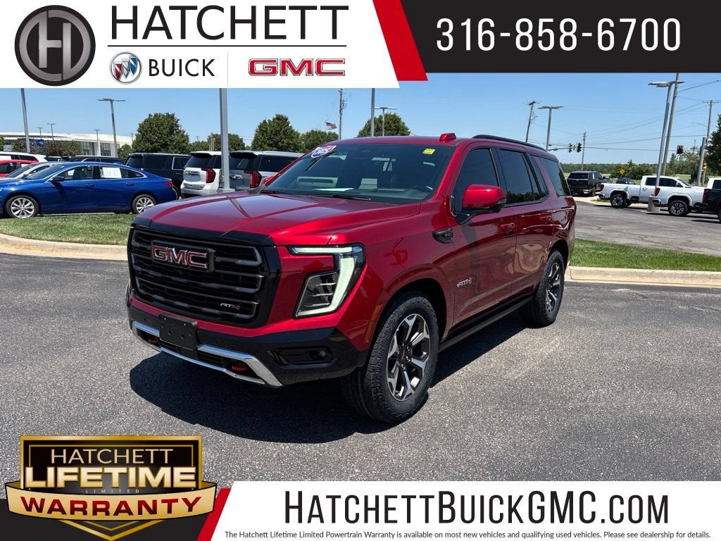 2025 GMC Yukon AT4 Ultimate in Volcanic Red Tintcoat — front three-quarter view