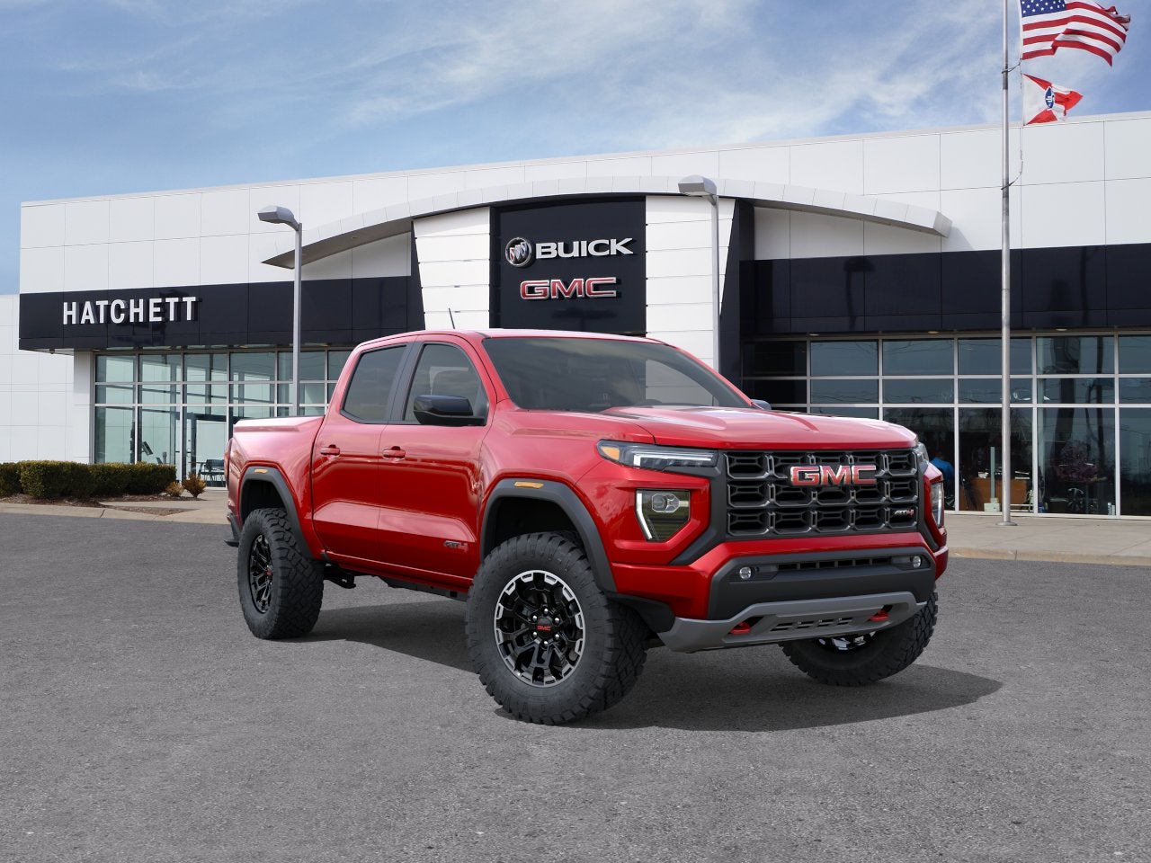 2026 GMC Canyon AT4 in Volcanic Red Tintcoat — front three-quarter view