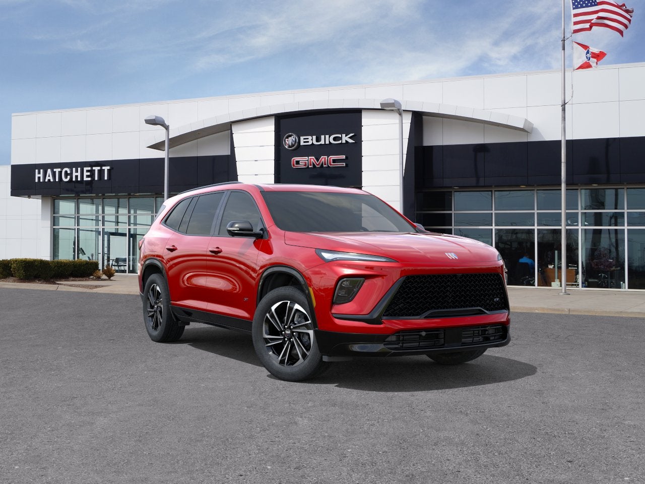 2026 Buick Enclave Sport Touring in Cherry Red Tintcoat — front three-quarter view