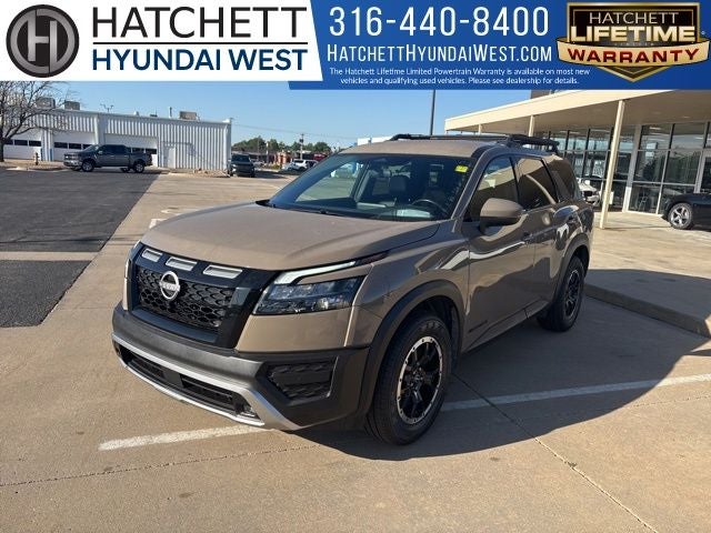 2023 Nissan Pathfinder Rock Creek in Baja Storm — front three-quarter view