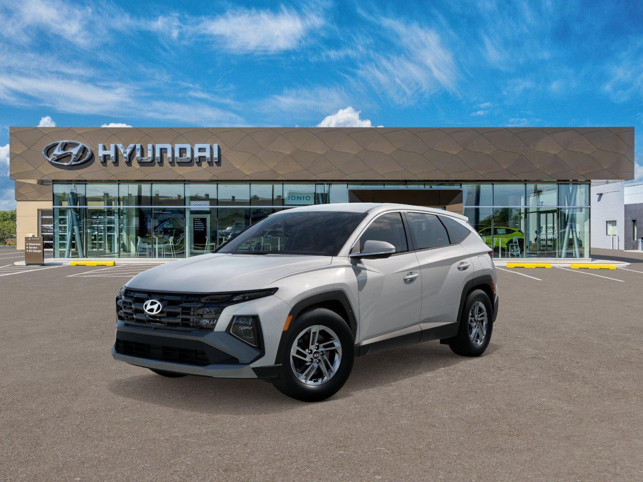 2026 Hyundai Tucson SE FWD in White Pearl — front three-quarter view
