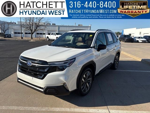 2025 Subaru Forester Touring in Crystal White Pearl — front three-quarter view