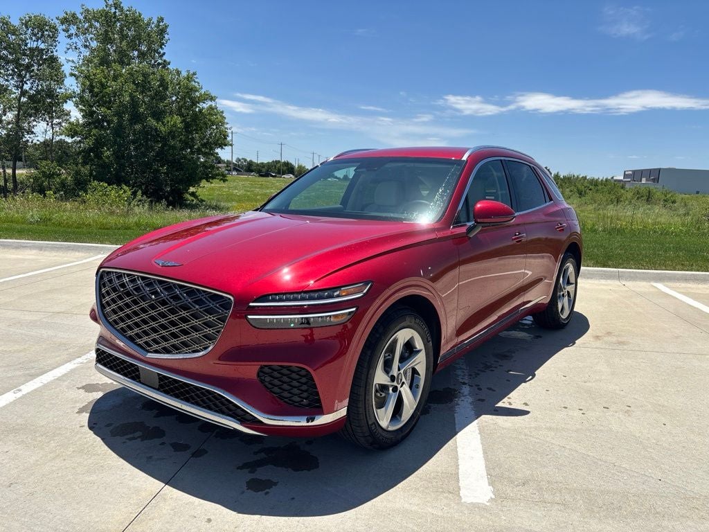 2026 Genesis GV70 2.5T in Mauna Red — front three-quarter view