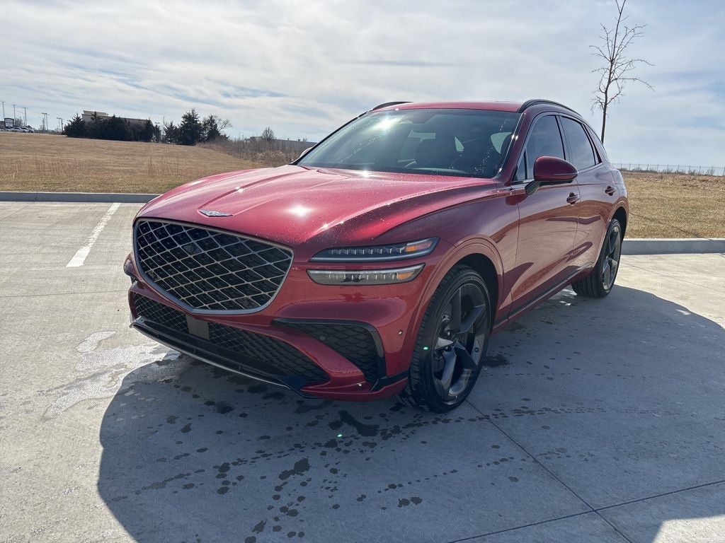 2026 Genesis GV70 2.5T Sport Prestige in Mauna Red — front three-quarter view